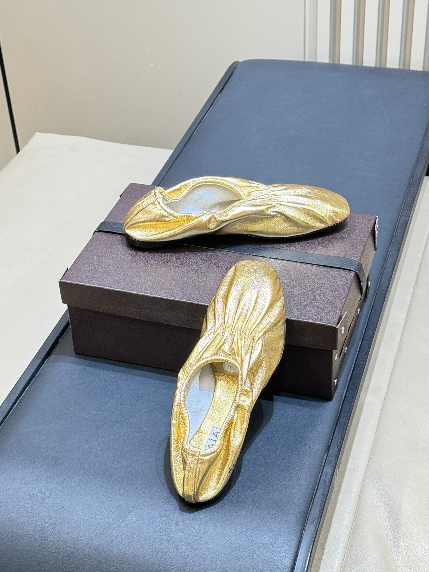 ALAIA 26S BALLET FLATS IN GOLD LAMBSKIN