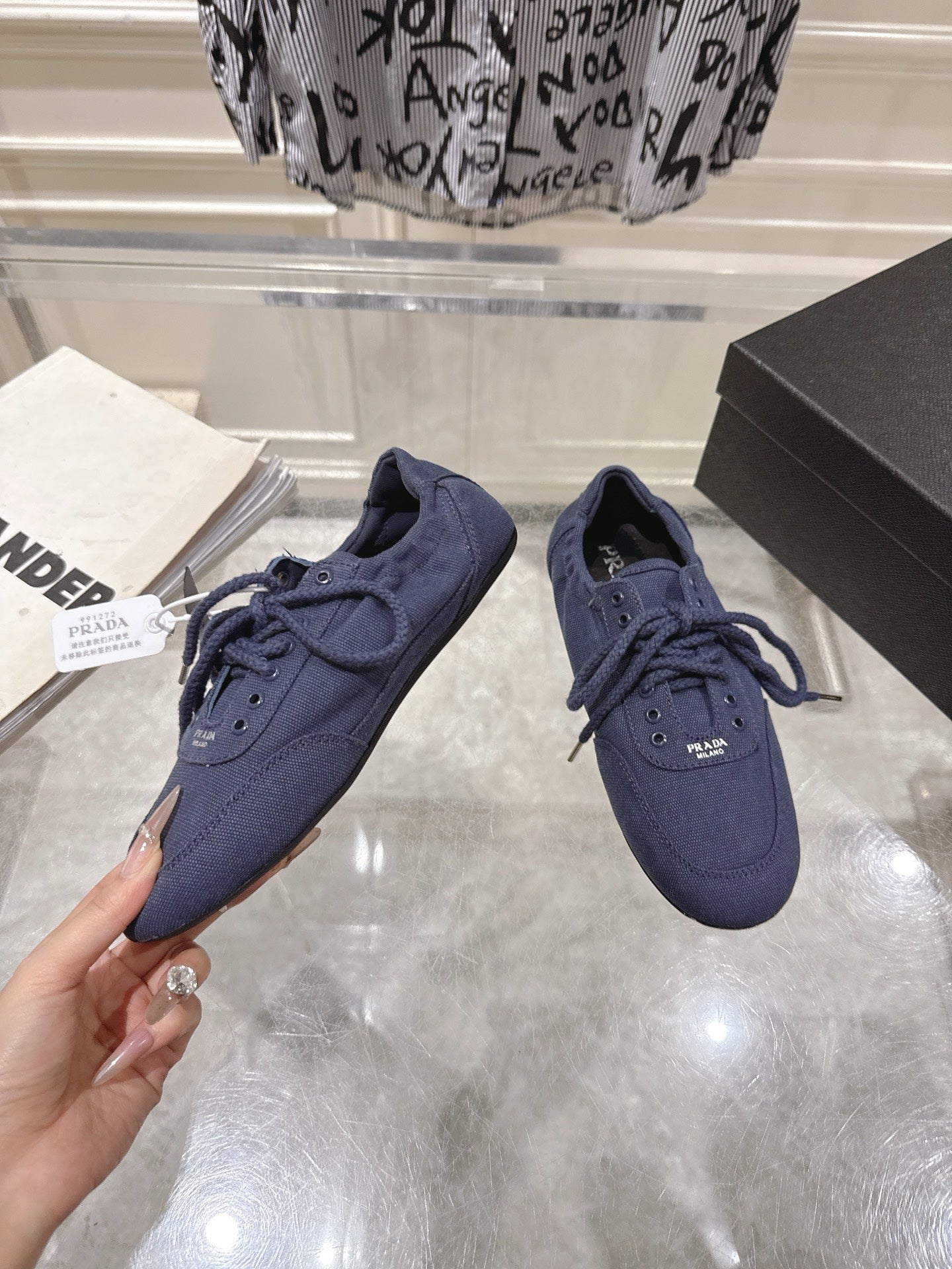 PRADA 26S COLLAPSE SNEAKERS IN BLUE CANVAS