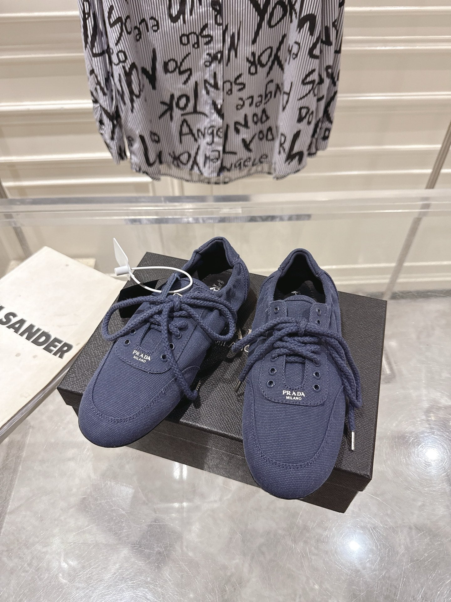 PRADA 26S COLLAPSE SNEAKERS IN BLUE CANVAS