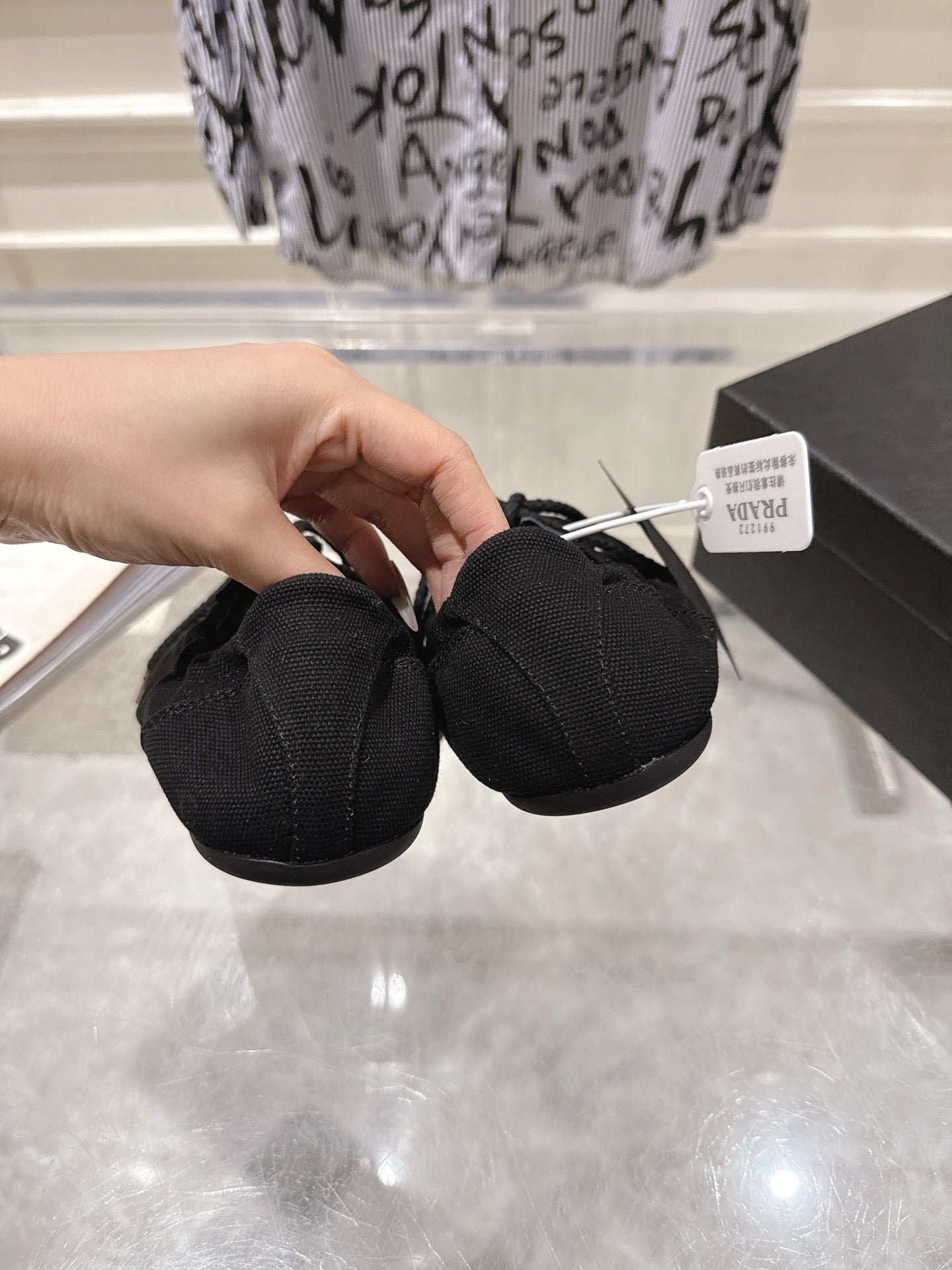 PRADA 26S COLLAPSE SNEAKERS IN BLACK CANVAS