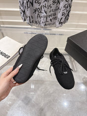 PRADA 26S COLLAPSE SNEAKERS IN BLACK CANVAS