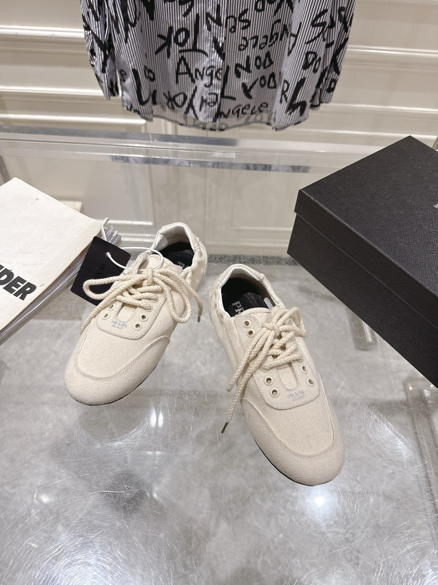 PRADA 26S COLLAPSE SNEAKERS IN WHITE CANVAS