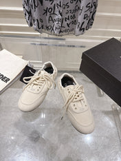 PRADA 26S COLLAPSE SNEAKERS IN WHITE CANVAS
