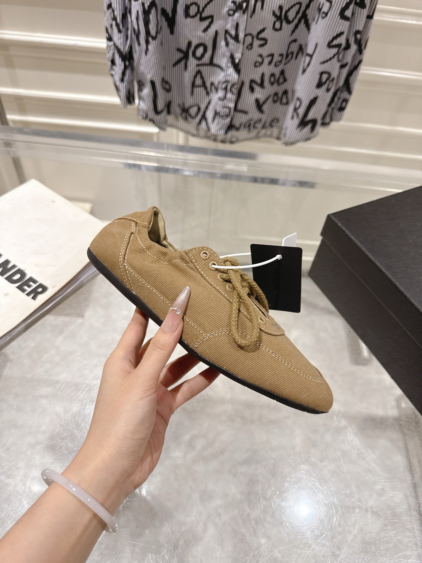 PRADA 26S COLLAPSE SNEAKERS IN BROWN CANVAS