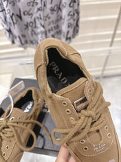PRADA 26S COLLAPSE SNEAKERS IN BROWN CANVAS