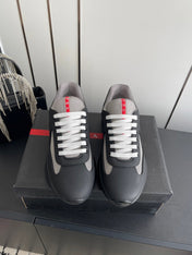 PRADA 26S AMERICA CUP SNEAKERS IN BLACK SOFT RUBBER AND BIKE FABRIC