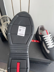 PRADA 26S AMERICA CUP SNEAKERS IN BLACK SOFT RUBBER AND BIKE FABRIC