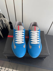 PRADA 26S AMERICA CUP SNEAKERS IN AZURE BLUE SOFT RUBBER AND BIKE FABRIC
