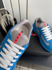 PRADA 26S AMERICA CUP SNEAKERS IN AZURE BLUE SOFT RUBBER AND BIKE FABRIC