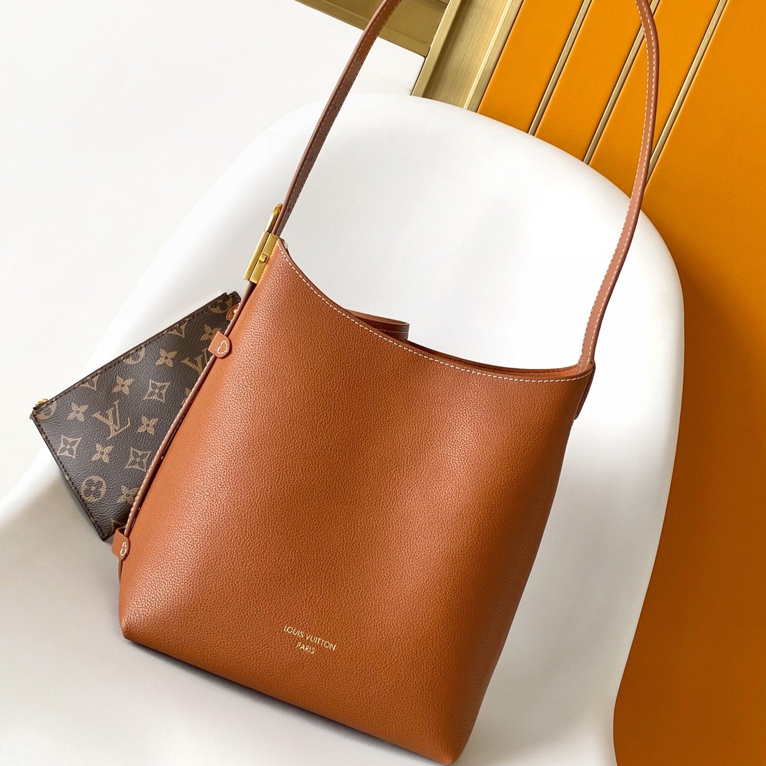 LV 25S LOW KEY HOBO BAG 35 CM IN BURNT ORANGE CALFSKIN