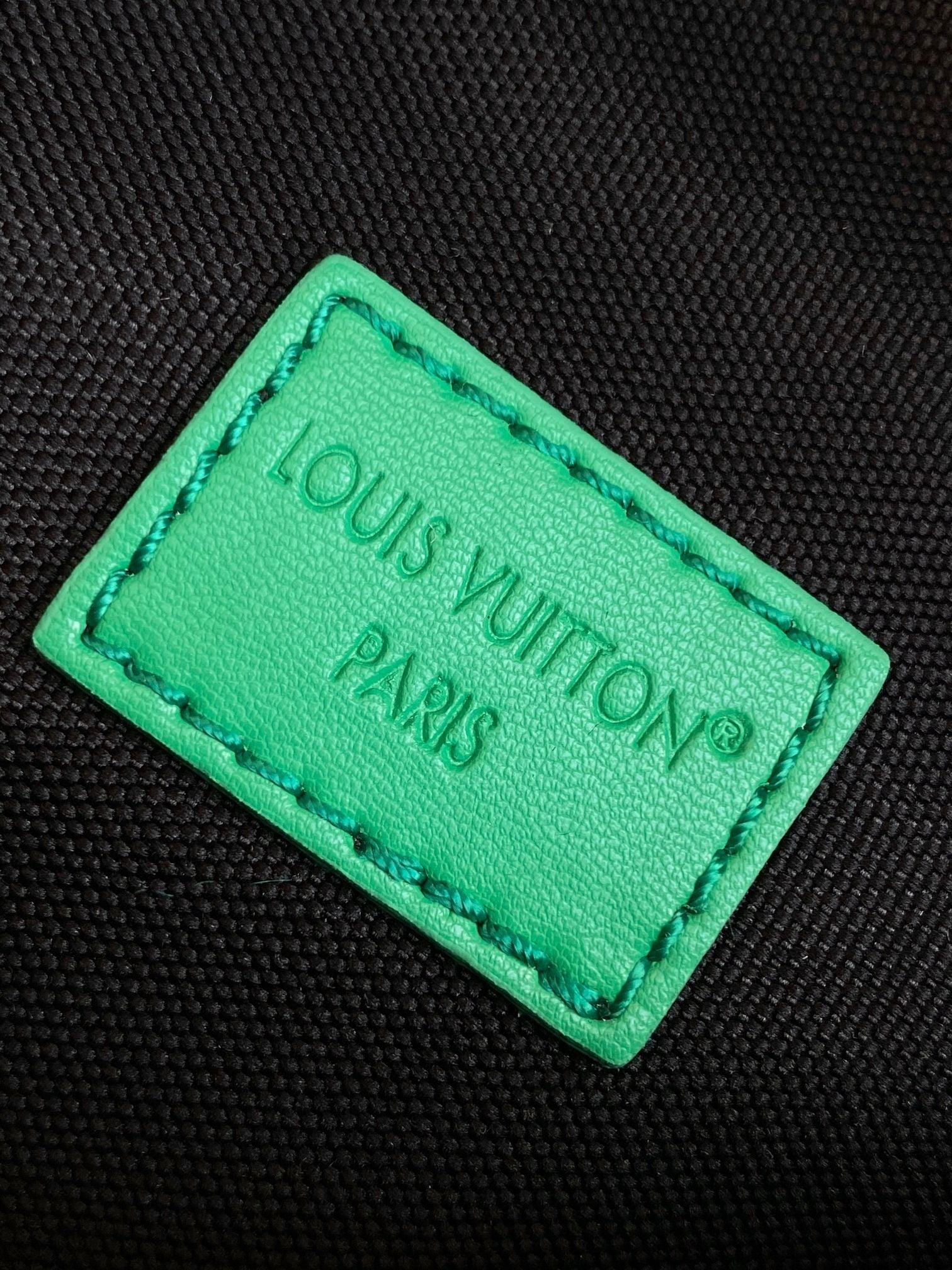 LV 25S DISCOVERY BUMBAG 44 IN BLACK NEON JADE MONOGRAM ECLIPSE CANVAS AND CALFSKIN