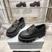 PRADA 25S THICK-SOLE LOAFERS 60 MM IN BLACK SMOOTH CALFSKIN