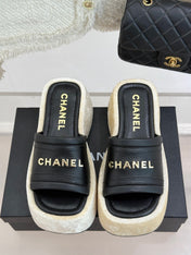 PLATFORM SLIPPERS IN BLACK LAMBSKIN