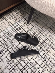 FLAT MULES IN BLACK CALFSKIN