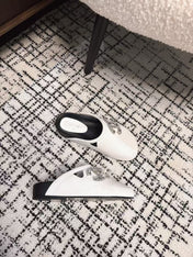 FLAT MULES IN WHITE CALFSKIN