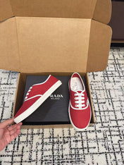 PRADA 26S LACE UP SNEAKERS IN RED CANVAS