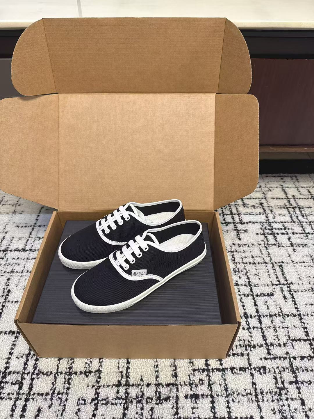 PRADA 26S LACE UP SNEAKERS IN BLACK AND WHITE CANVAS