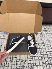 PRADA 26S LACE UP SNEAKERS IN BLACK AND WHITE CANVAS