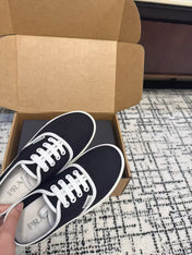 PRADA 26S LACE UP SNEAKERS IN BLACK AND WHITE CANVAS
