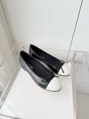 CHANEL 26S BALLET FLATS IN BLACK CRACKED CALFSKIN WITH WHITE TOE CAP AND BOW