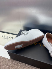 ALAIA MARY JANE FLATS 25S IN WHITE CALFSKIN WITH SILVER HARDWARE