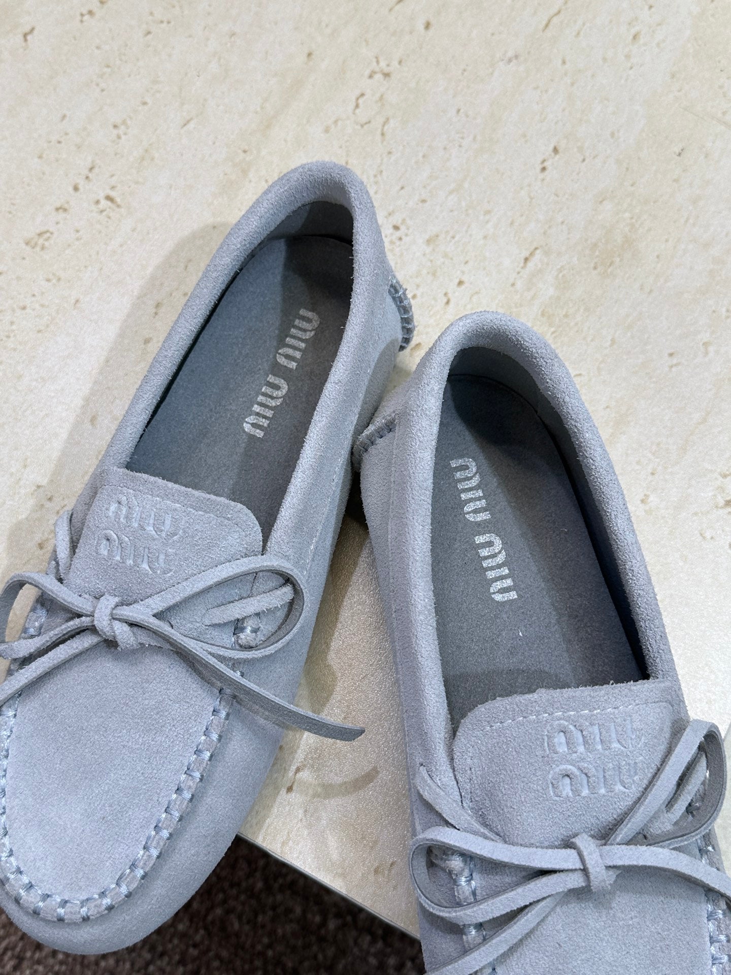 MIUMIU 26S LOAFERS IN LIGHT BLUE SUEDE WITH BOW
