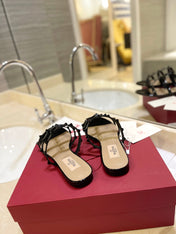 VALENTINO 26S ROCKSTUD CAGED SANDALS IN BLACK PATENT CALFSKIN