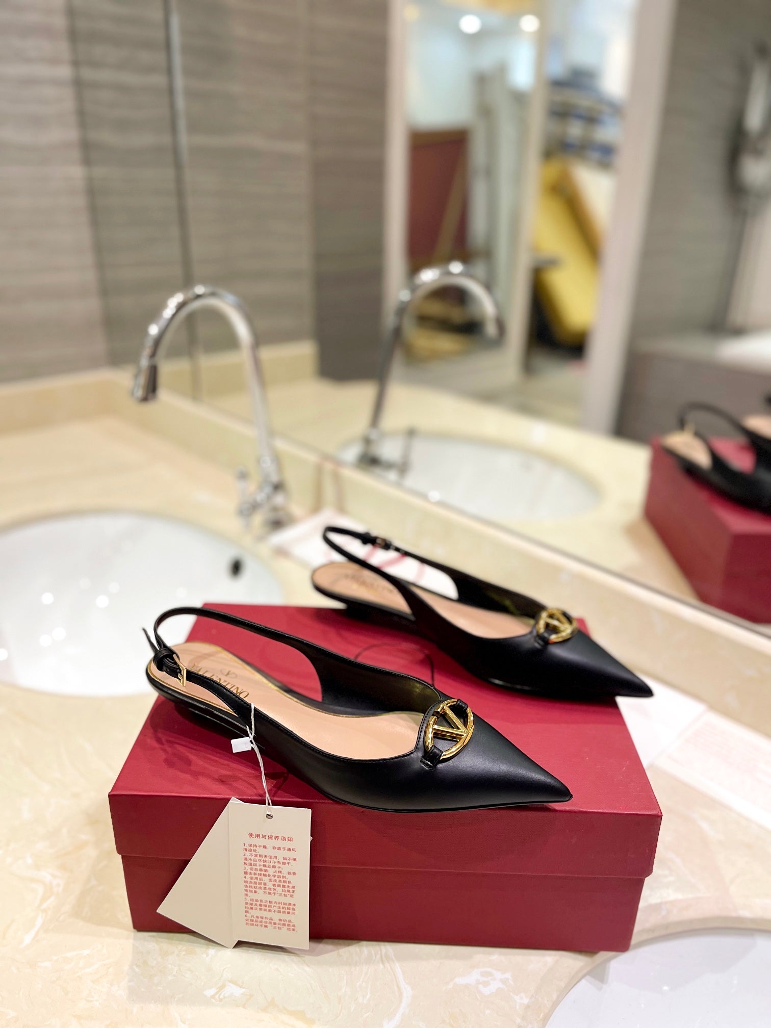 VALENTINO 26S POINTED TOE FLAT SLINGBACKS IN BLACK CALFSKIN