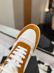 MID-TOP SNEAKERS IN WHITE PERFORATED LAMBSKIN AND BRONZE ORANGE SUEDE