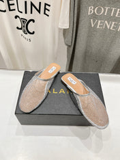 ALAIA FLAT MULES IN SILVER MESH FISHNET