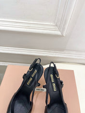 MIUMIU 26S SLINGBACK PUMPS 85MM IN BLACK CALFSKIN