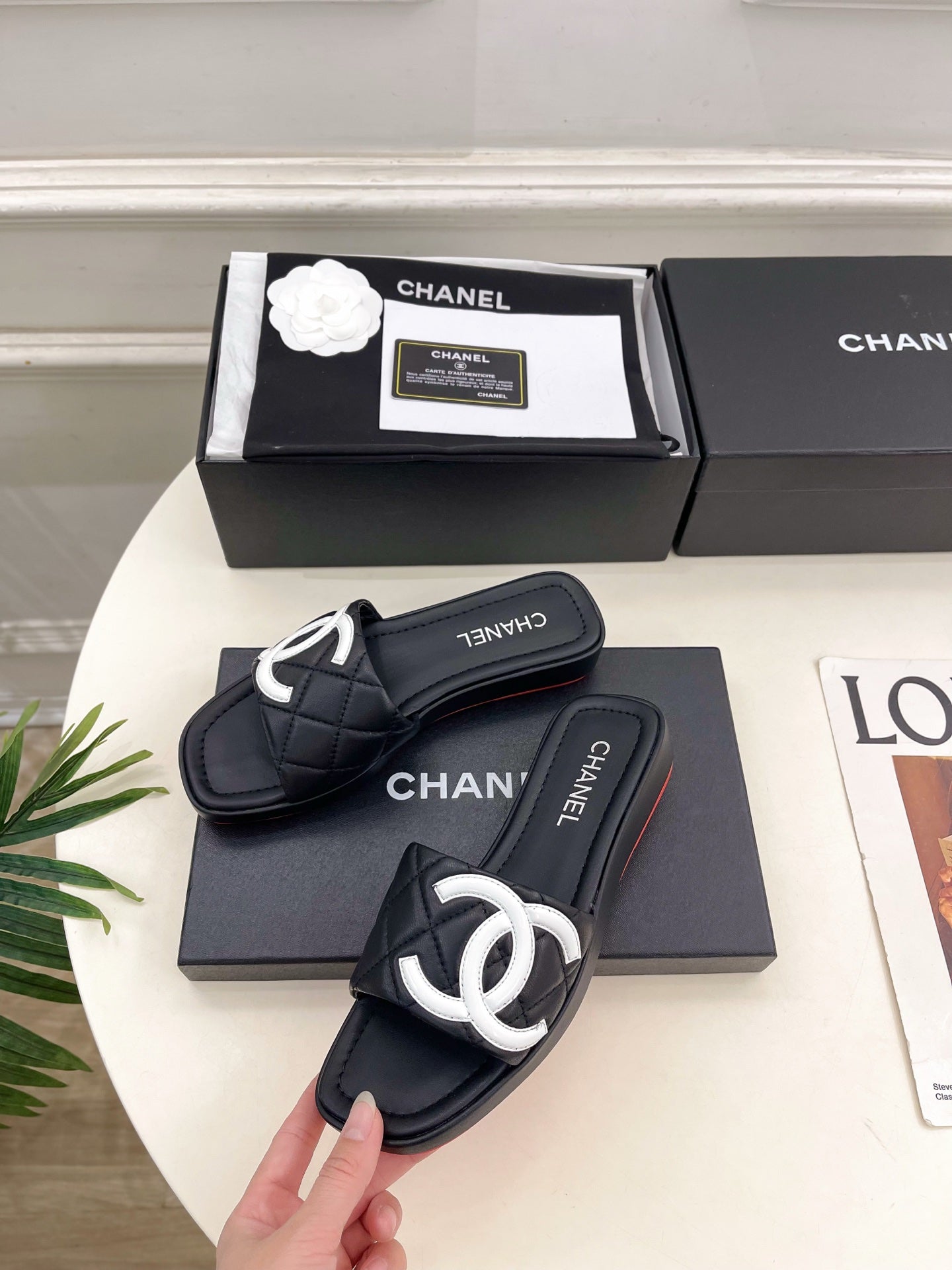CHANEL 26S FLAT SLIDES IN BLACK LAMBSKIN WITH WHITE CC LOGO