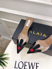 ALAIA 26S MULE HEELS 55 MM IN BLACK LAMBSKIN AND TRANSPARENT PVC