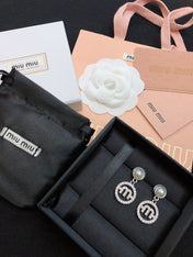 MIUMIU 26S PEARL DROP CRYSTAL LOGO CIRCLE EARRINGS IN SILVER TONE METAL 615772