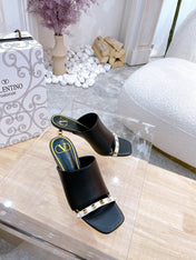 ROCKSTUD TOWER-HEEL MULES IN BLACK CALFSKIN 7 CM