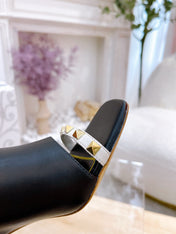 ROCKSTUD TOWER-HEEL MULES IN BLACK CALFSKIN 7 CM